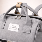 Mochila pañalera multifuncional con cuna portátil